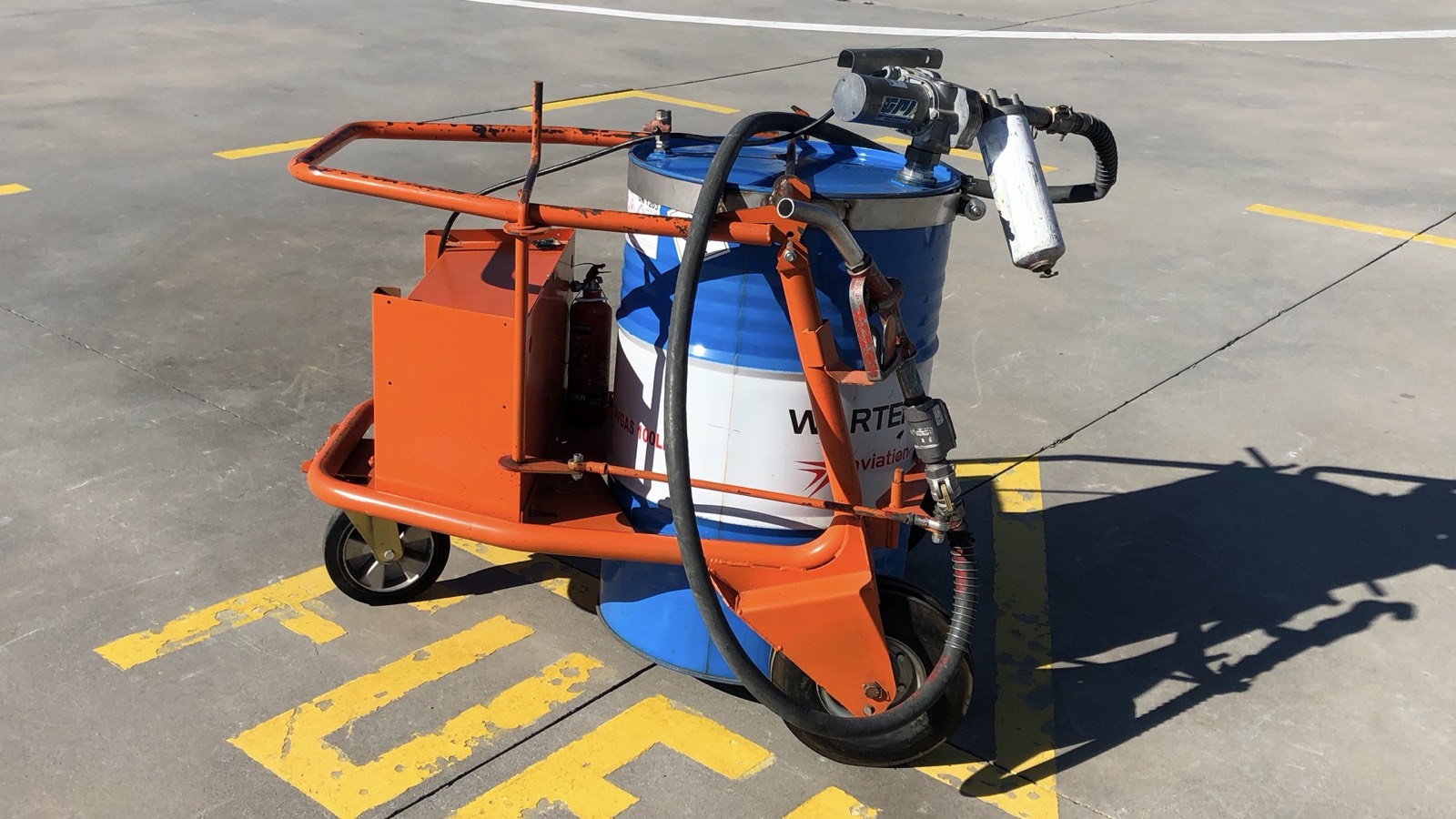 Orange Condor Nest aviation fuel cart with drum and pump