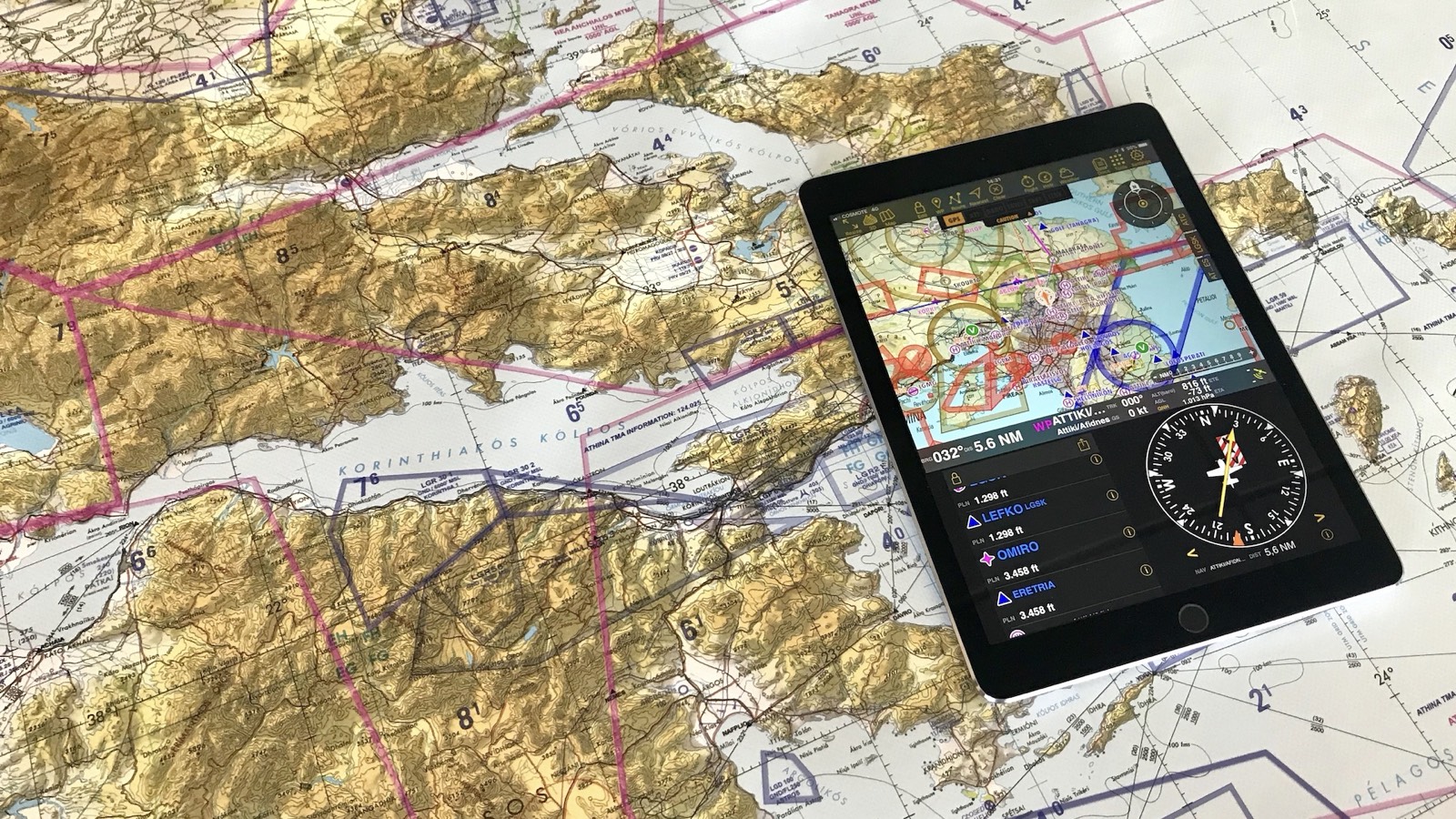 Aeronautical chart and tablet in the pilot lounge